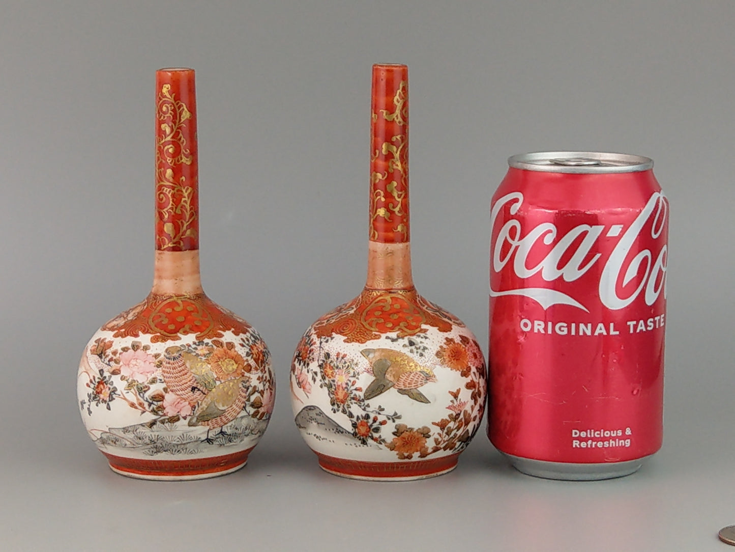 A Pair Of Japanese Kutani Vases with Parcel Gilt And Iron Red Ground narrow neck