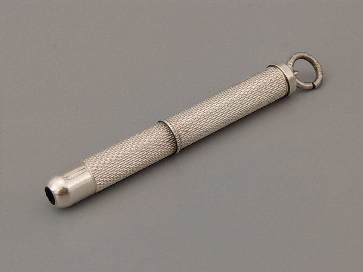 Sterling silver Toothpick pendant with gold tip by William Manton