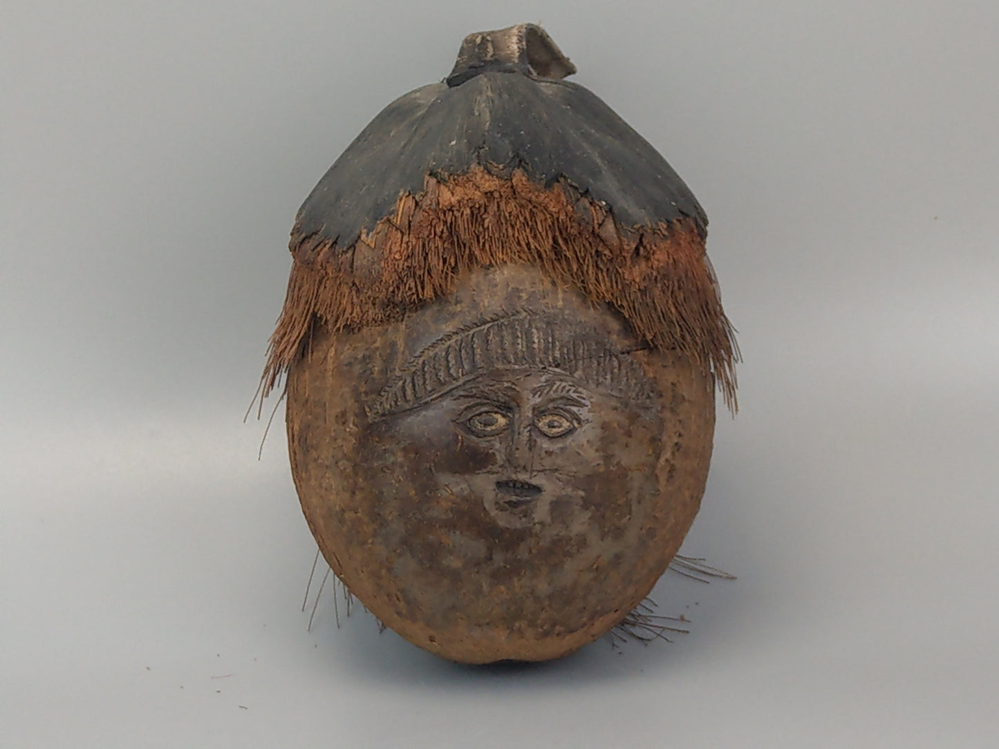 Carved Coconut shell creepy face art from Oceania Polynesia c1960