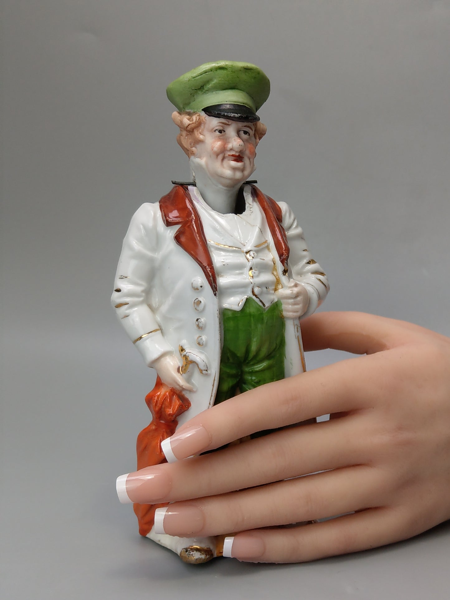 Nodding head figurine: Gentleman with umbrella, German bisque porcelain
