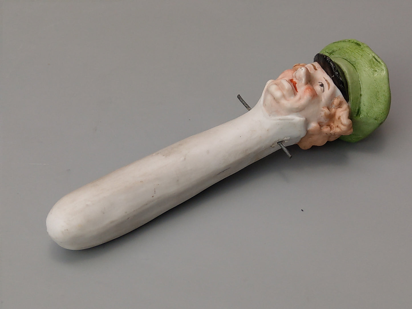 Nodding head figurine: Gentleman with umbrella, German bisque porcelain