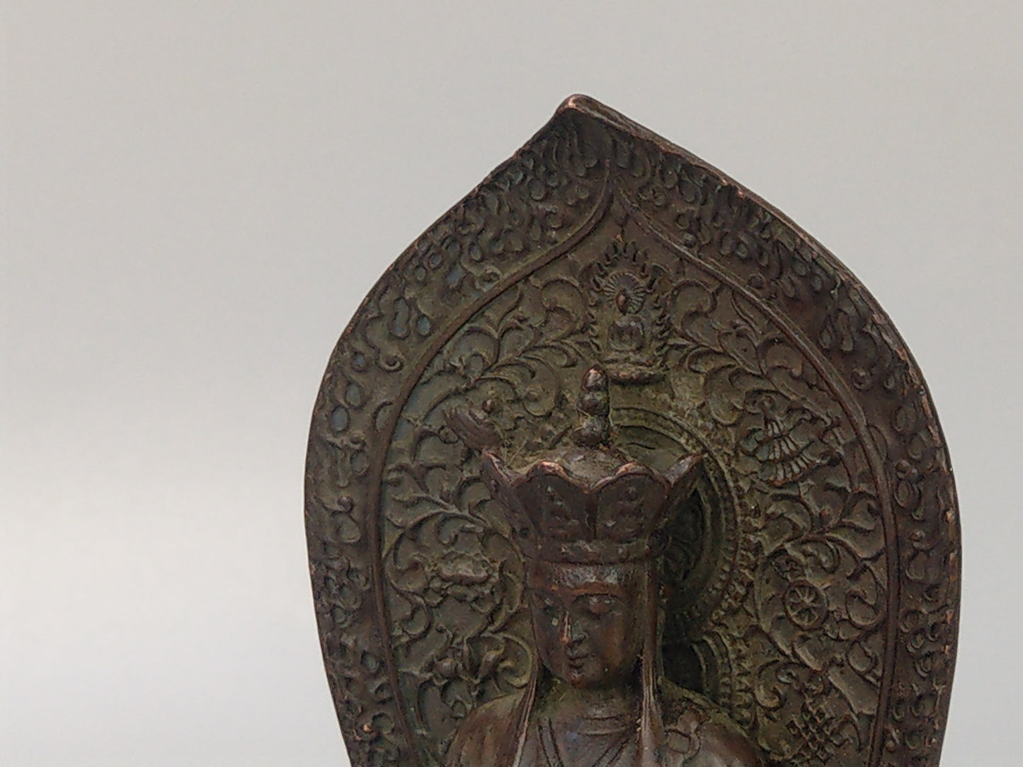 Antique Small Crowned Buddha on Lotus Leaf