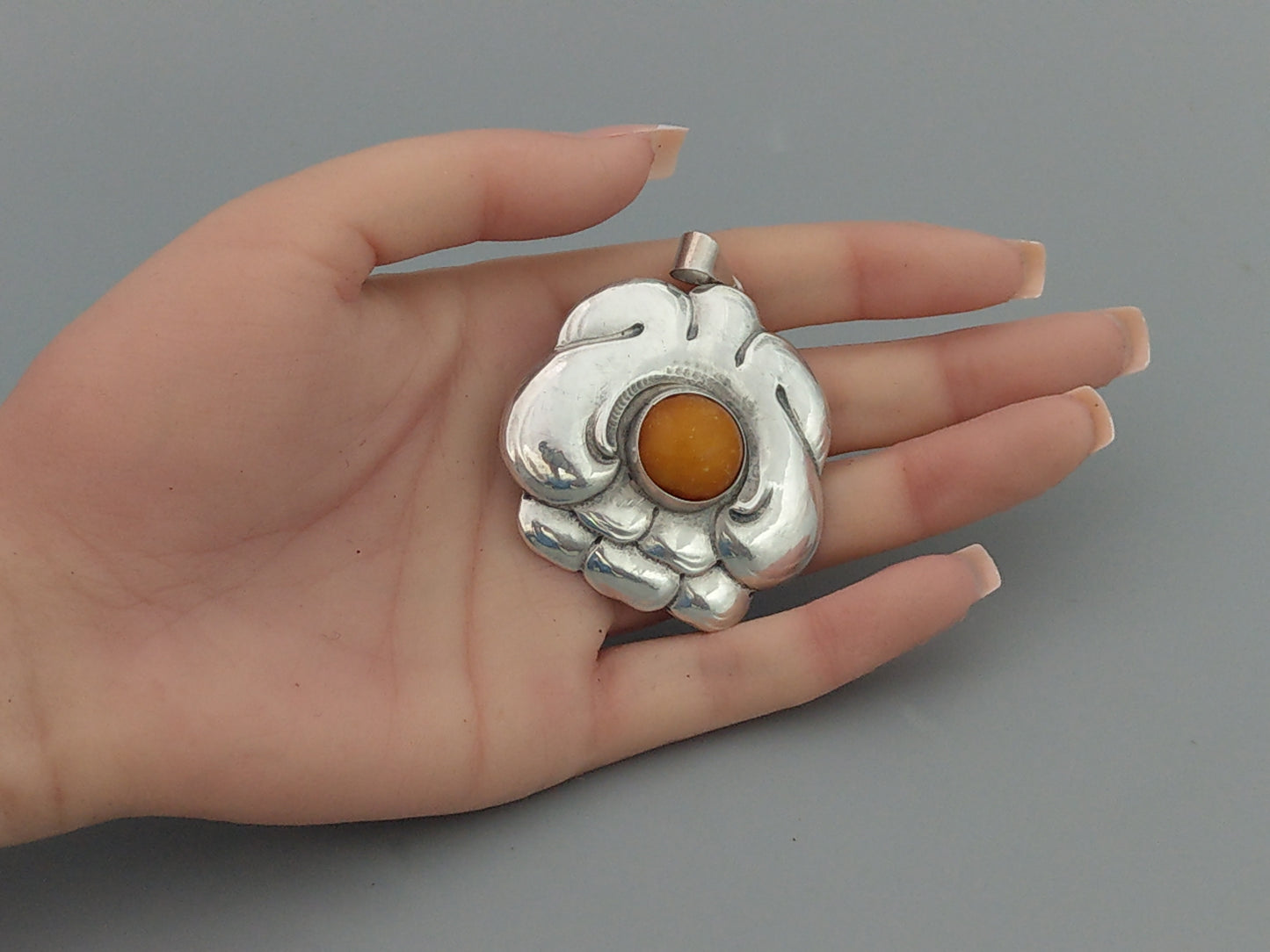 Turun Hopea Oy Pendant with Butterscotch Egg Amber