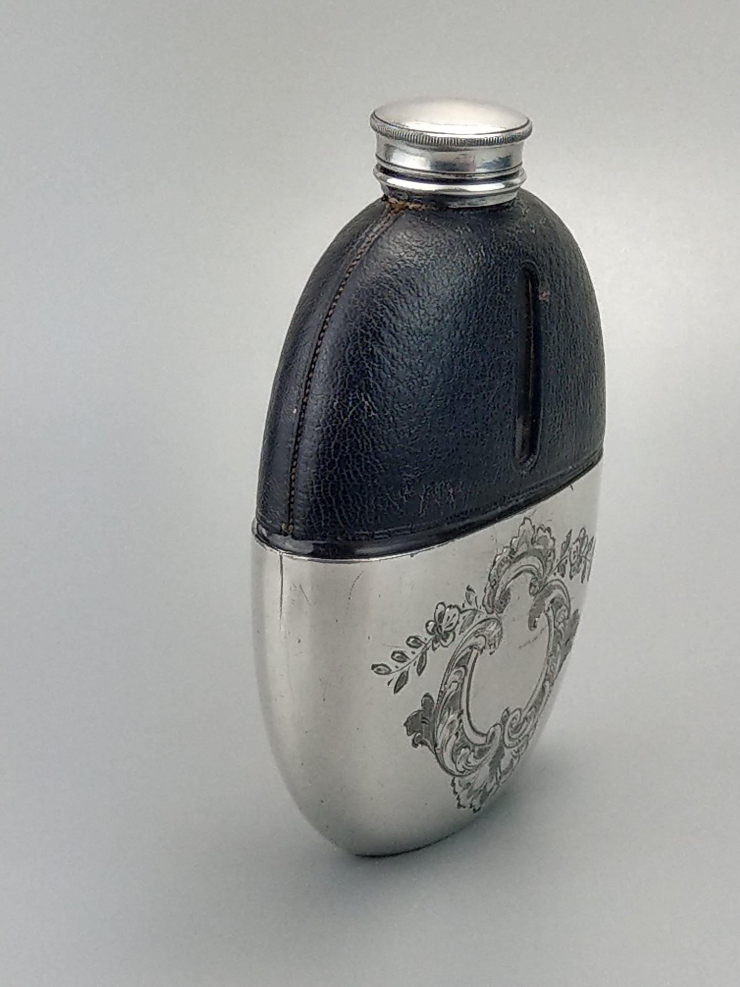 Antique Oval Hip Flask with cup leather covered by James Dixon