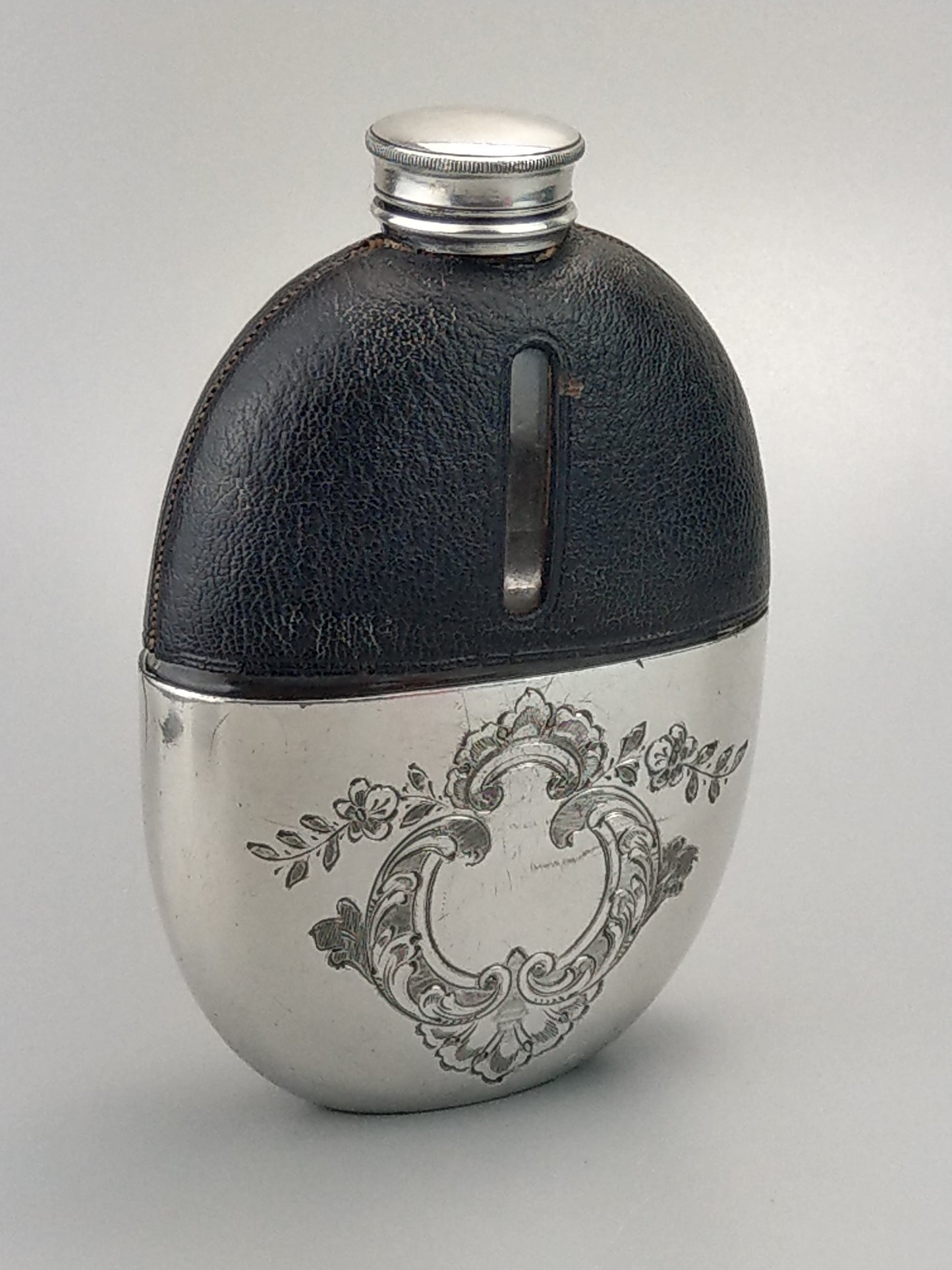 Antique Oval Hip Flask with cup leather covered by James Dixon