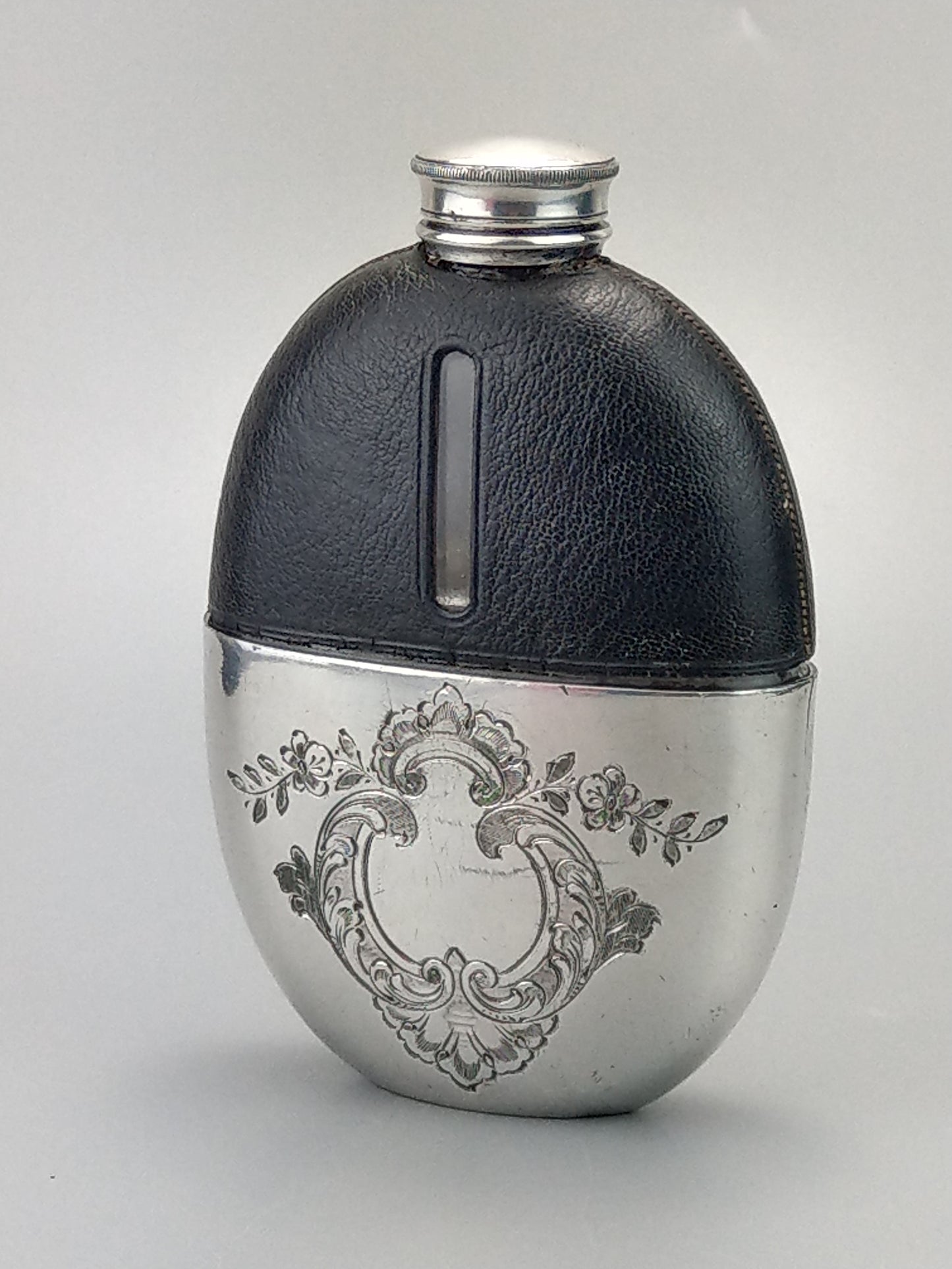 Antique Oval Hip Flask with cup leather covered by James Dixon