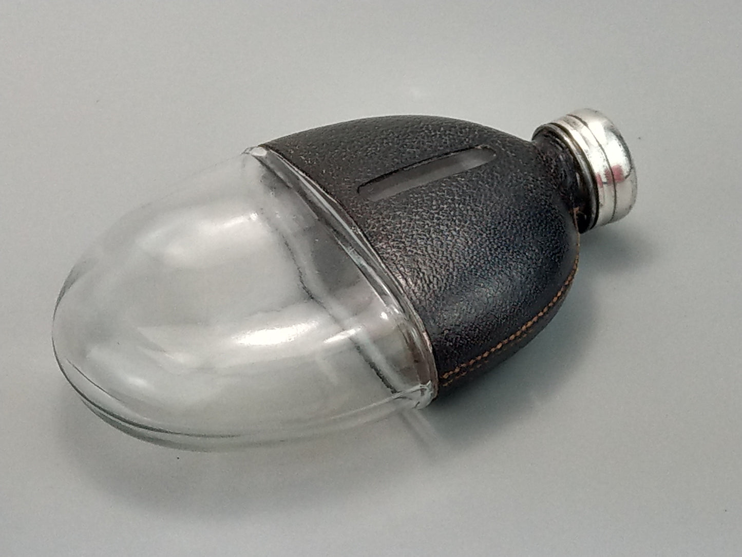 Antique Small Oval Glass Hip Flask with cup leather covered c1920