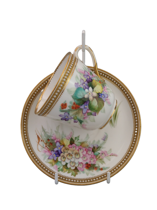 Royal Worcester tea cup and saucer, floral with jewelled borders, initials WY, c.1879