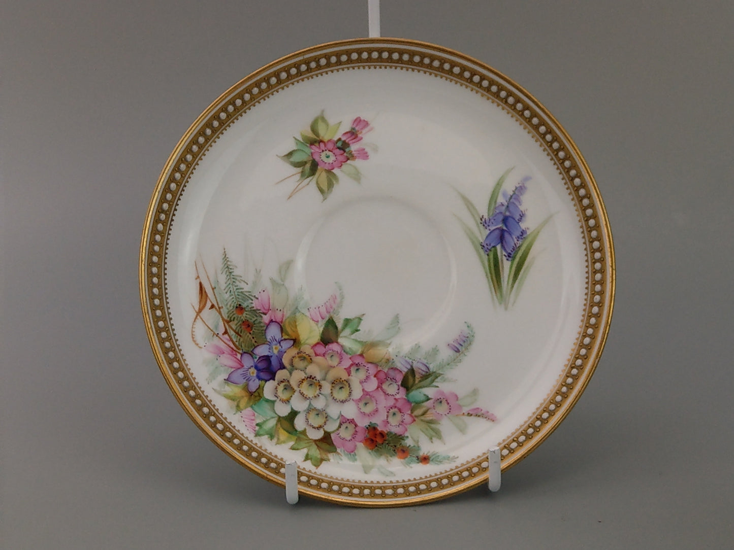 Royal Worcester tea cup and saucer, floral with jewelled borders, initials WY, c.1879