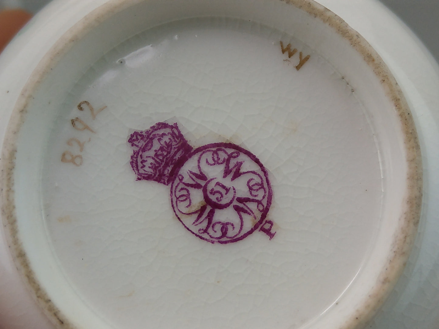 Royal Worcester tea cup and saucer, floral with jewelled borders, initials WY, c.1879