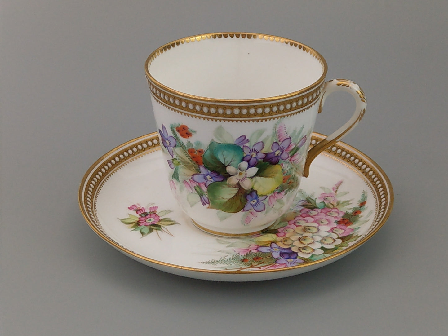 Royal Worcester tea cup and saucer, floral with jewelled borders, initials WY, c.1879