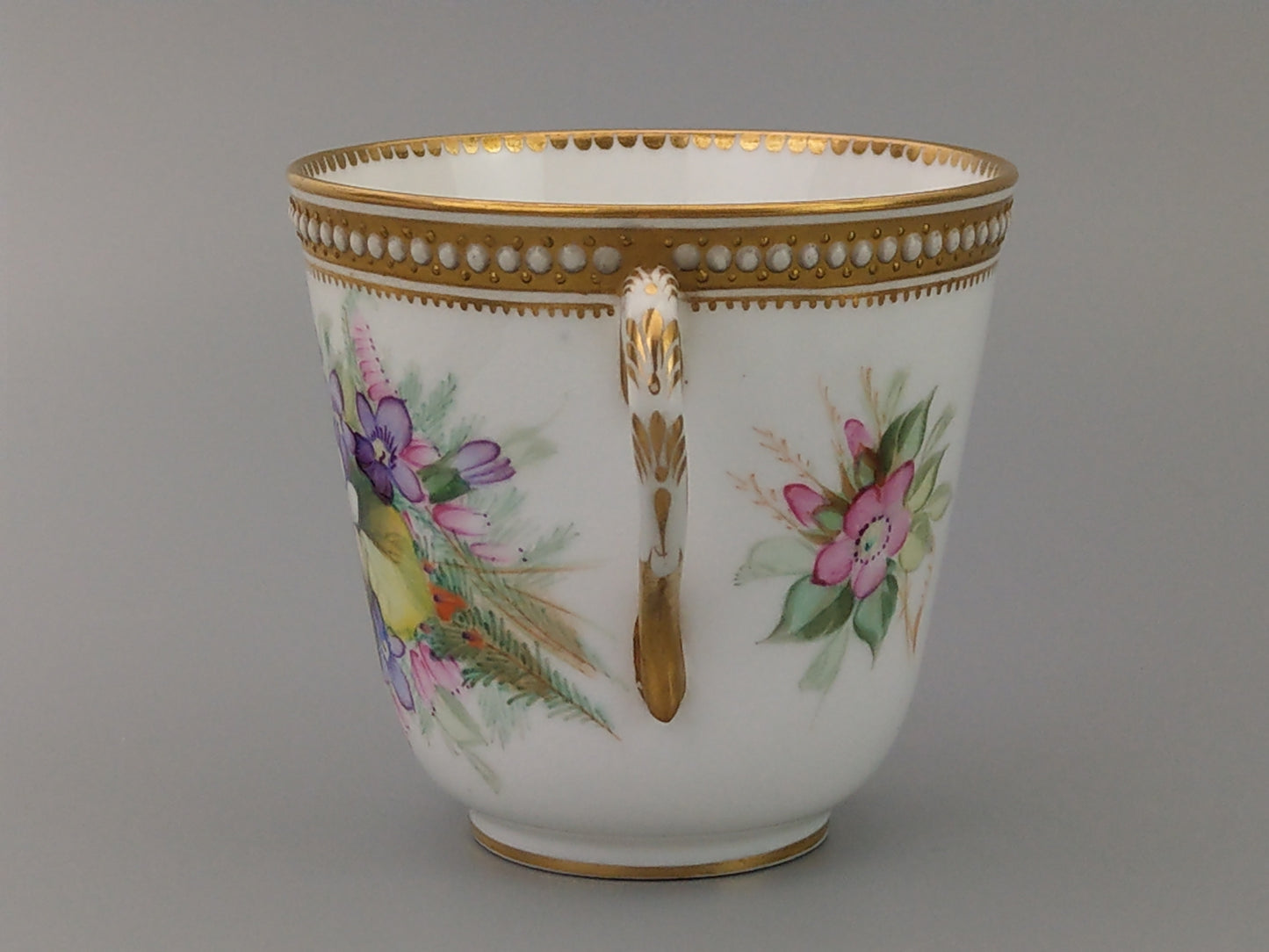 Royal Worcester tea cup and saucer, floral with jewelled borders, initials WY, c.1879