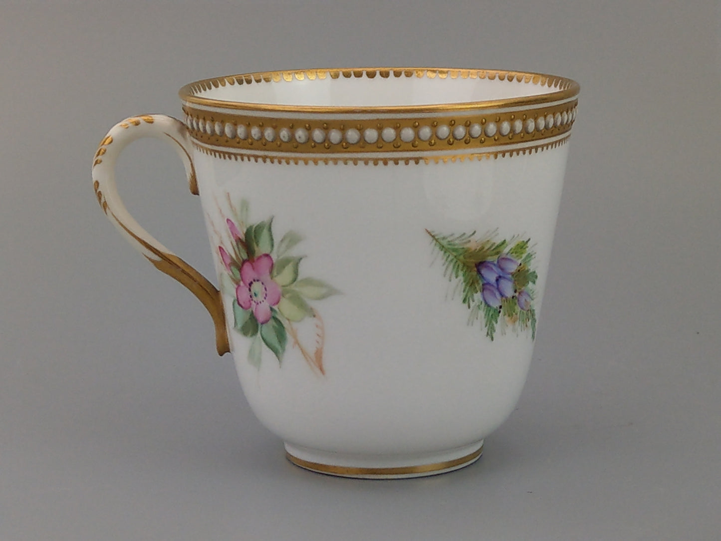 Royal Worcester tea cup and saucer, floral with jewelled borders, initials WY, c.1879