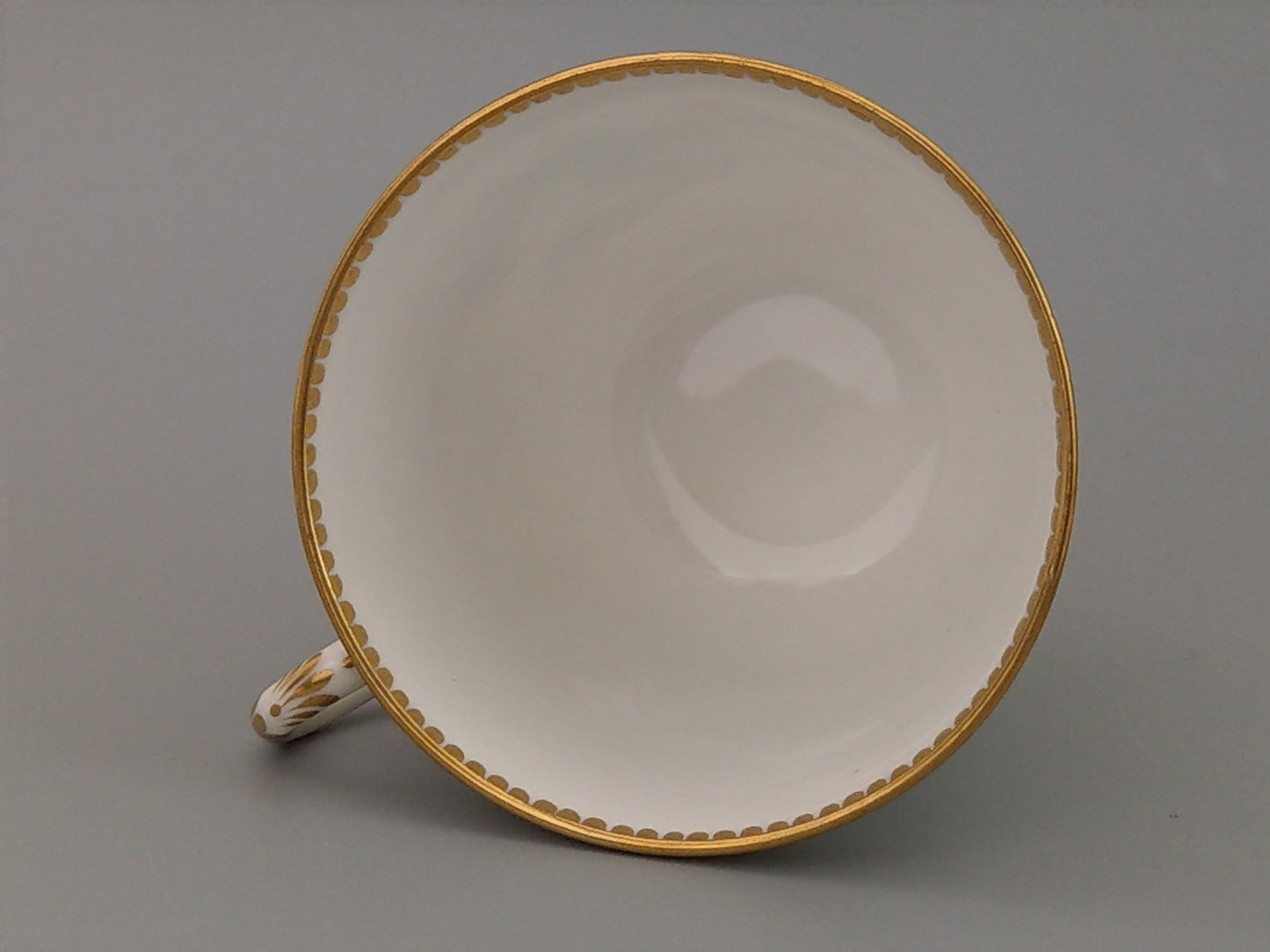 Royal Worcester tea cup and saucer, floral with jewelled borders, initials WY, c.1879