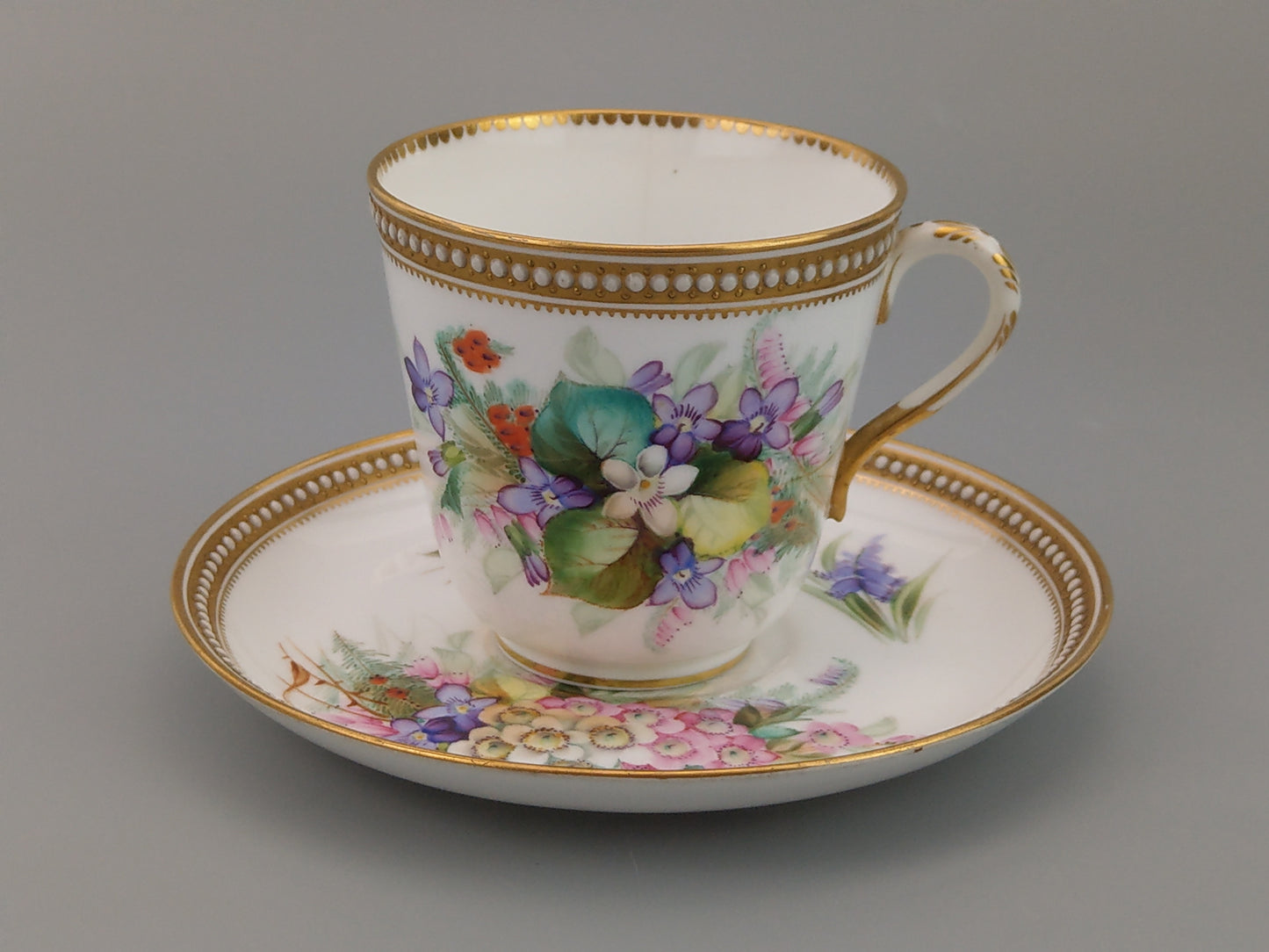 Royal Worcester tea cup and saucer, floral with jewelled borders, initials WY, c.1879