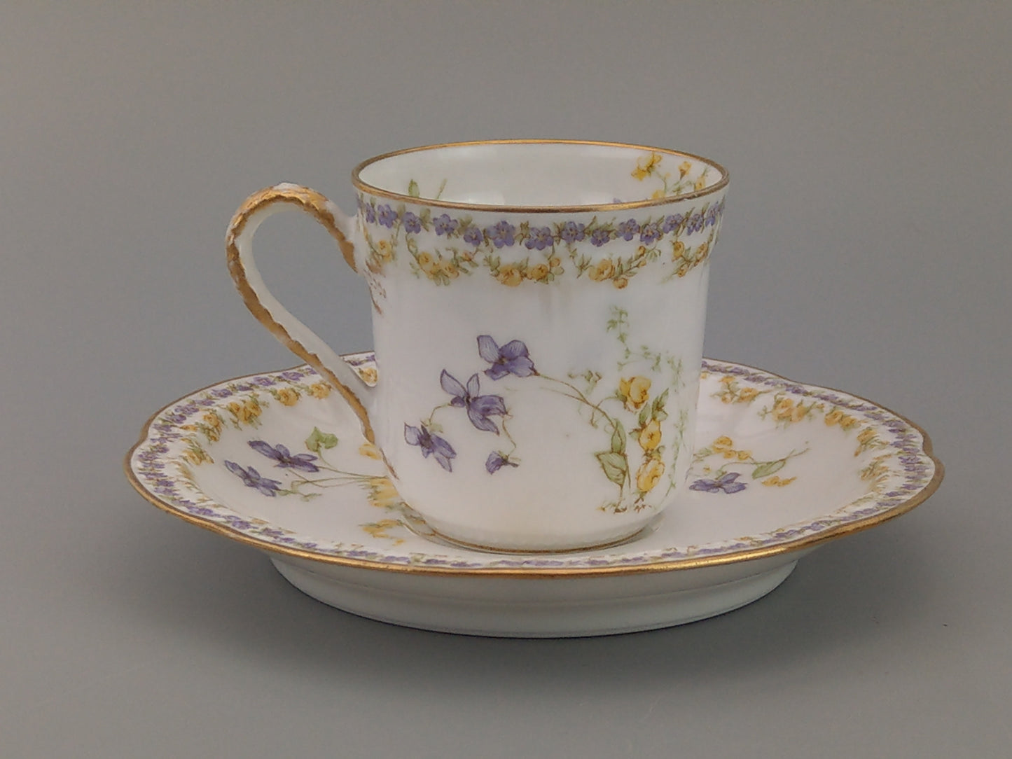 Limoges Coffee Can and Saucer Lavender and Yellow Floral Havilland and Co