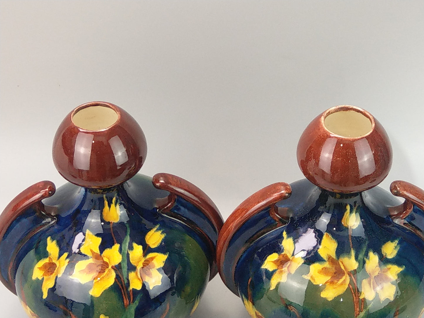 A Pair of Large Austrian Old Moravian Pottery Vases with Daffodils