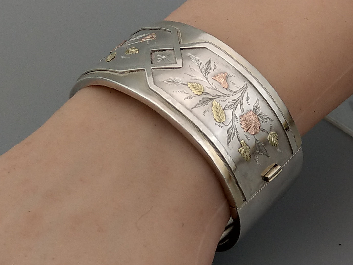 Antique sterling silver bangle with gold inlay flowers