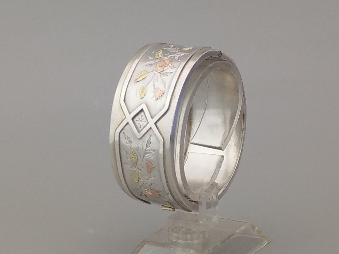 Antique sterling silver bangle with gold inlay flowers