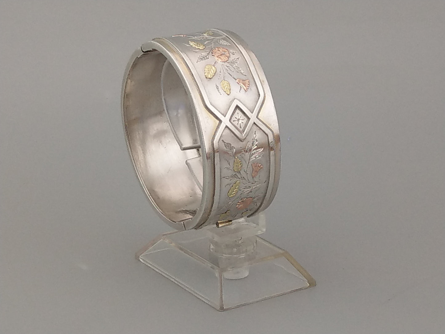 Antique sterling silver bangle with gold inlay flowers