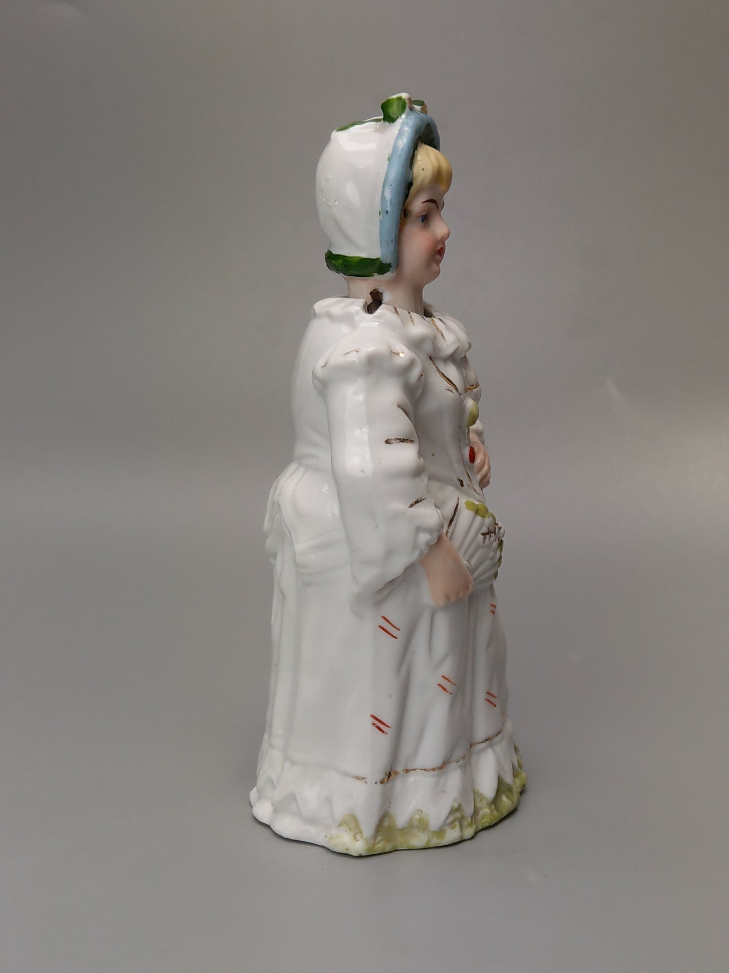 Nodding head figurine Girl in harlequin costume German Bisque porcelain