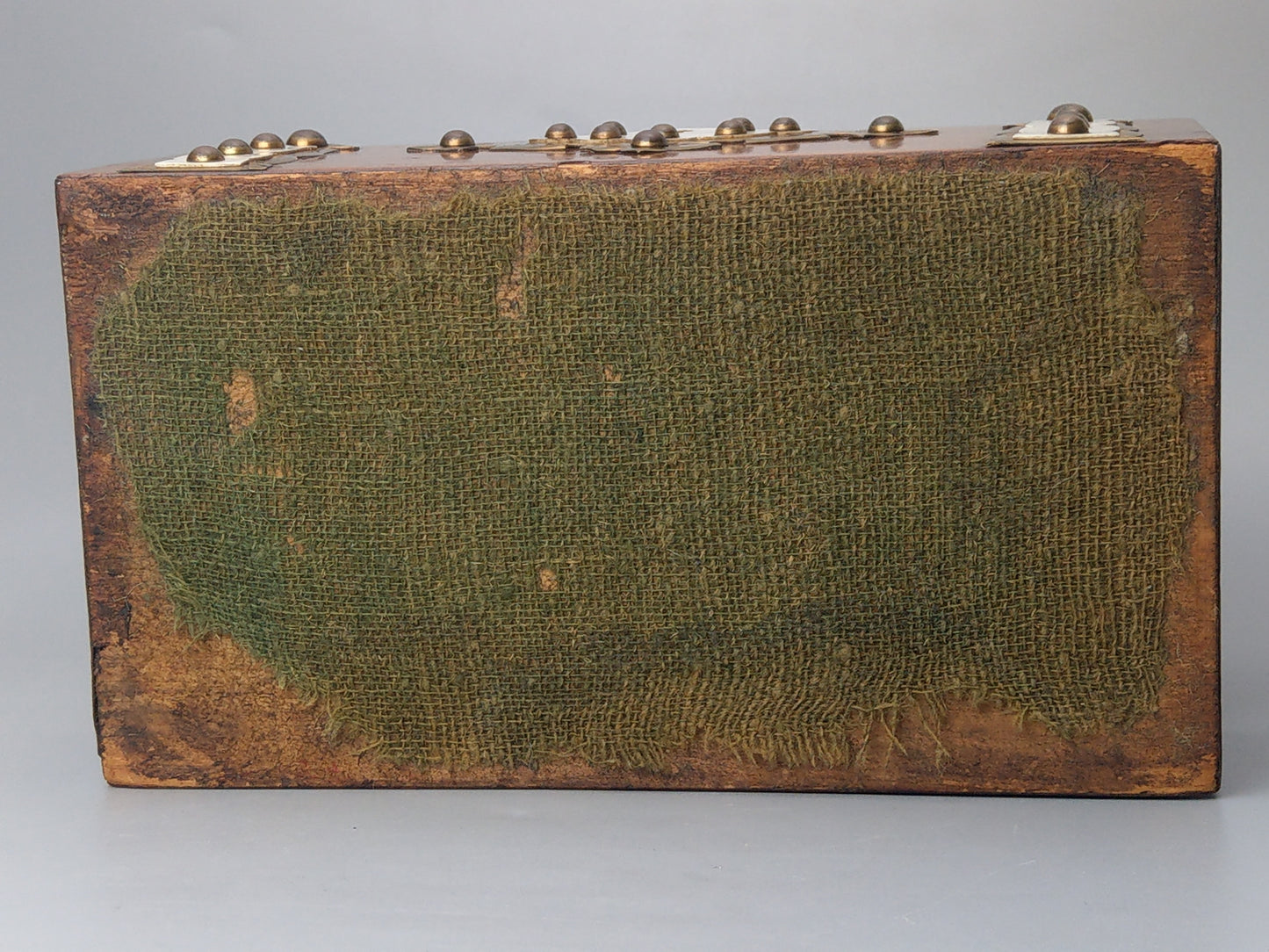 Victorian Burr walnut tea caddy with brass strapwork.