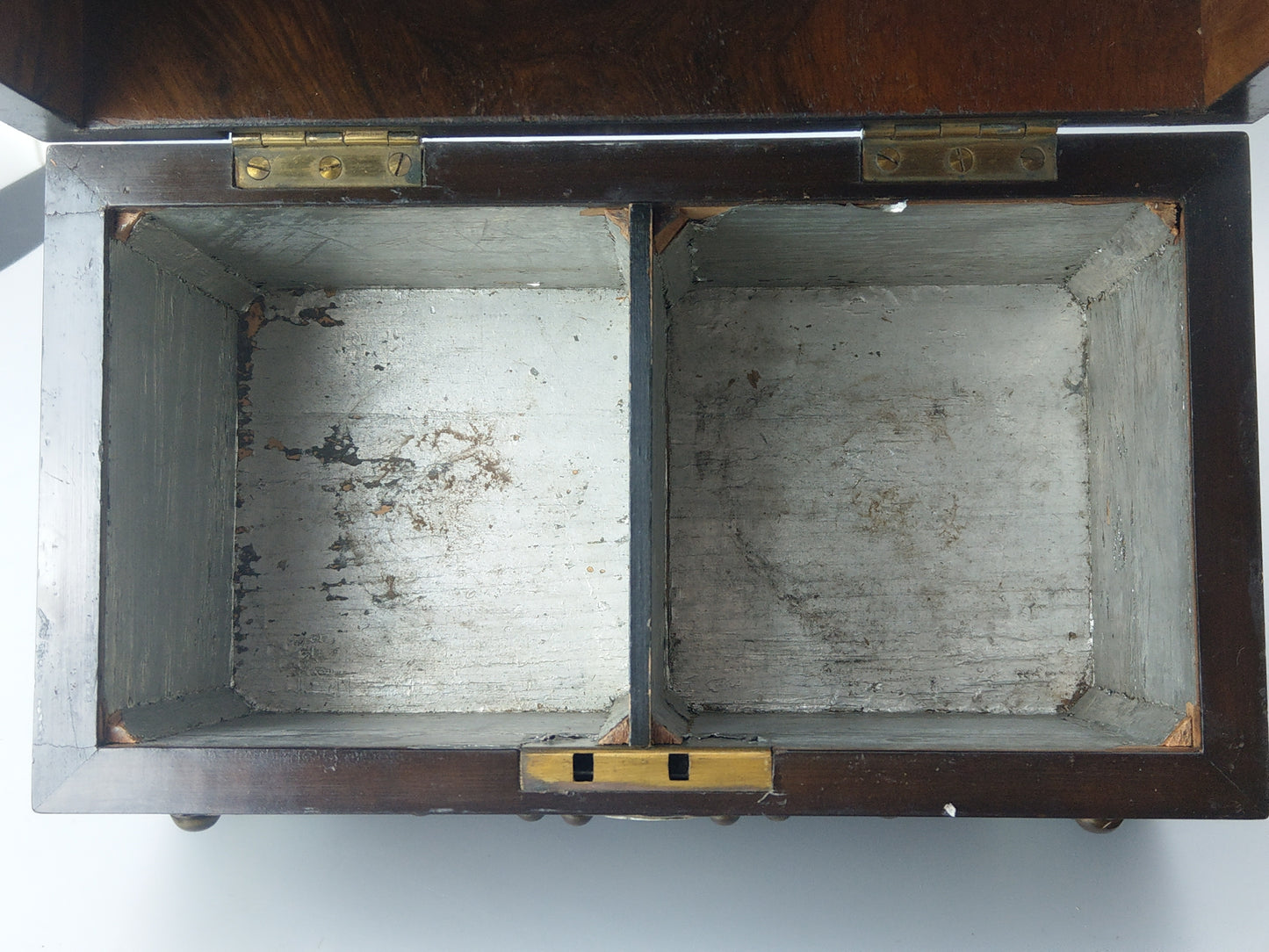 Victorian Burr walnut tea caddy with brass strapwork.