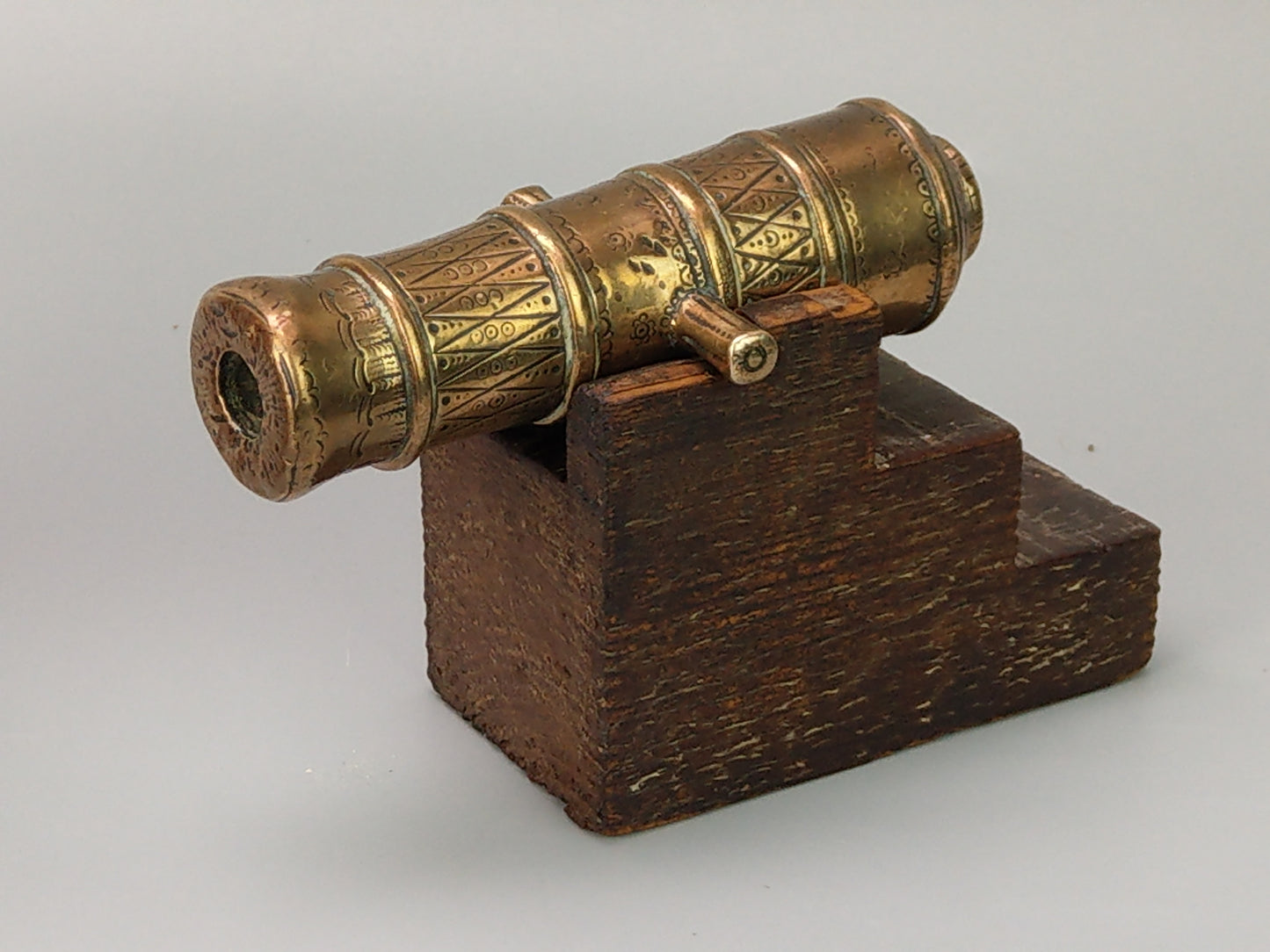 Antique Chased bronze signal cannon on wood stand