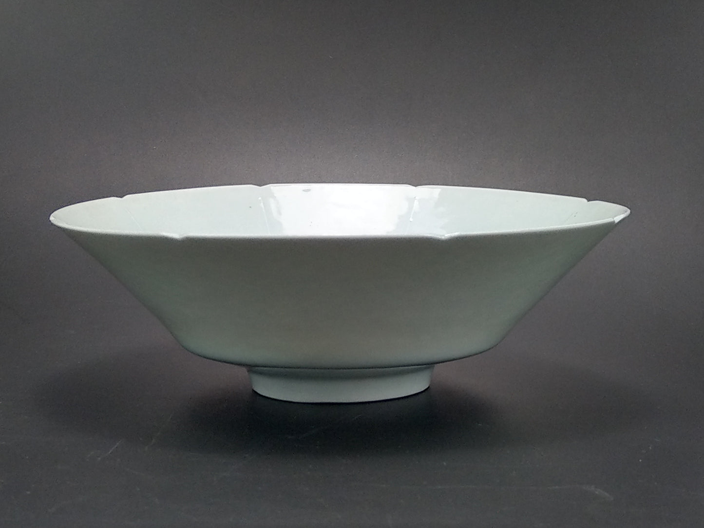 Chinese Qingbai conical porcelain bowl with duck egg blue glaze incised and foliate rim