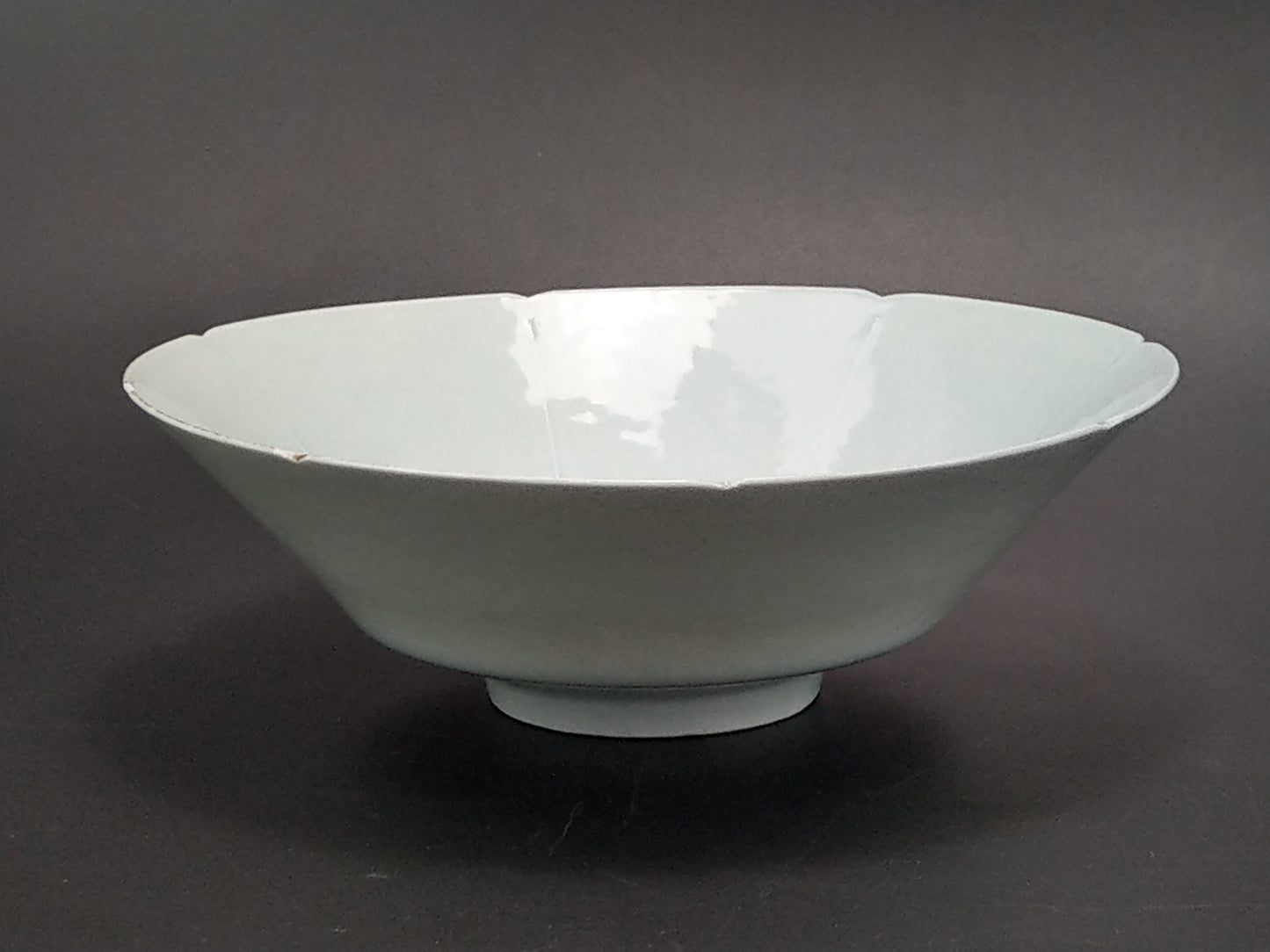 Chinese Qingbai conical porcelain bowl with duck egg blue glaze incised and foliate rim
