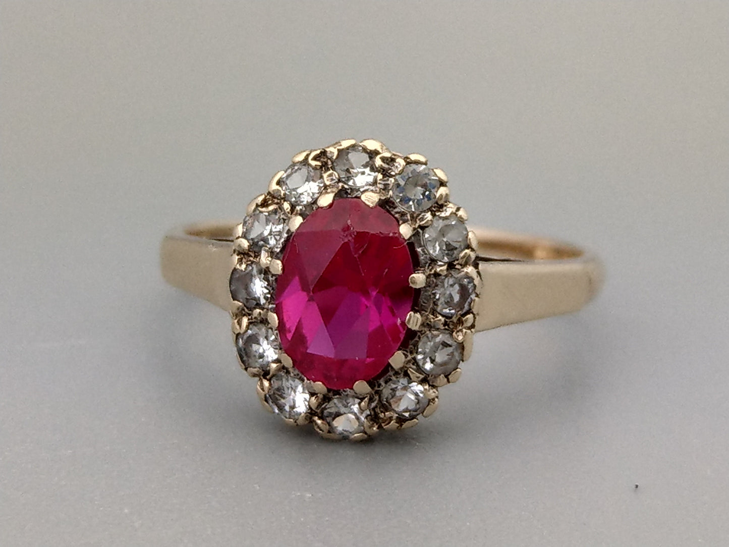 9ct Gold ring set with Pink Sapphire stone and white gem stones