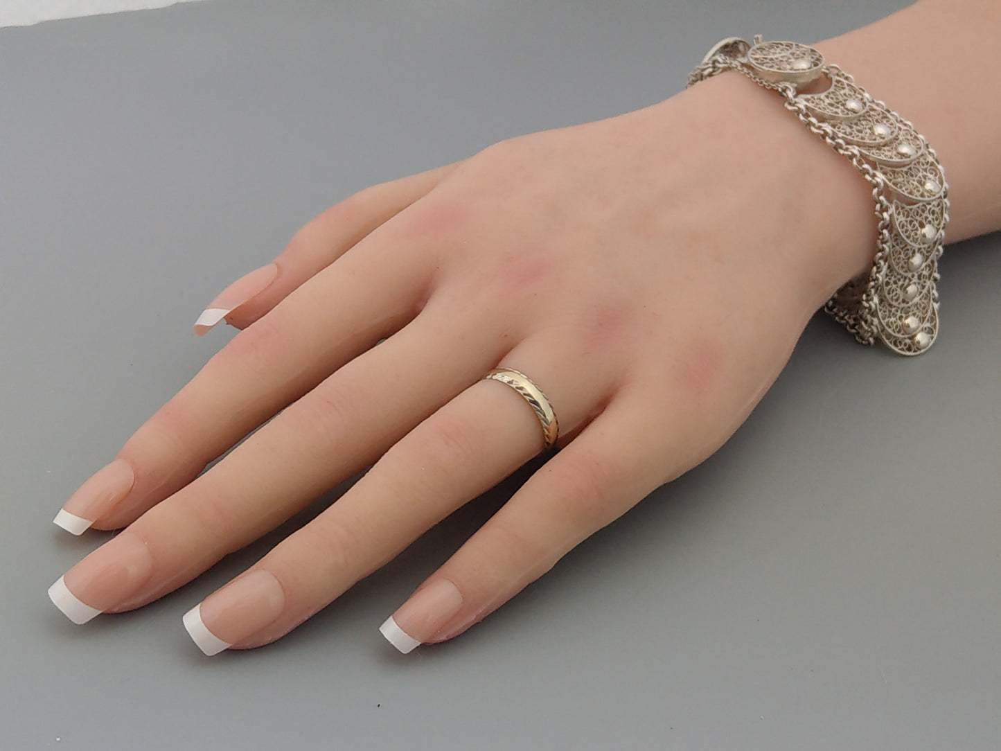 White 9ct Gold Simple Band Ring With Hammered Edge by Excalibur Jewellery