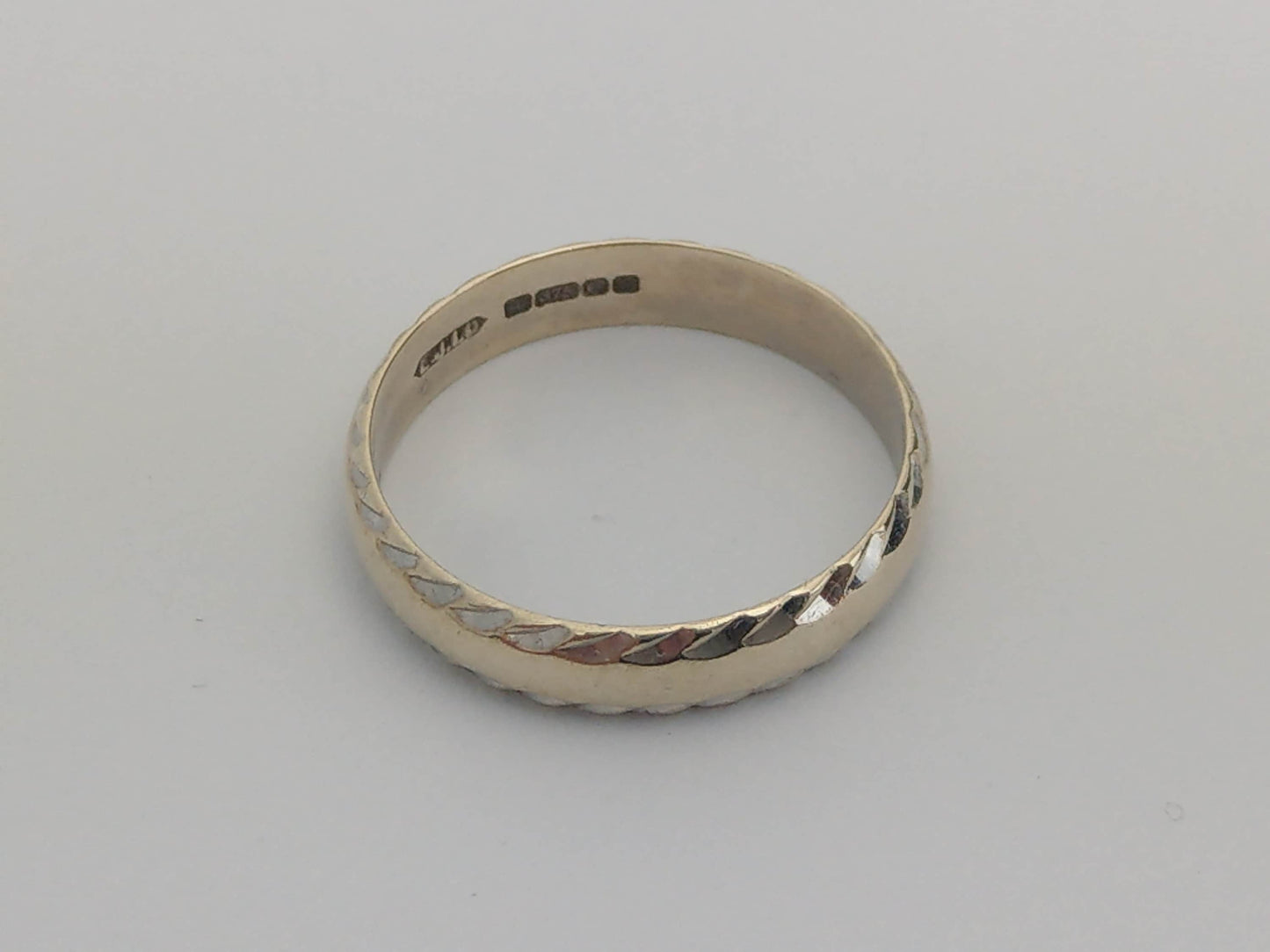 White 9ct Gold Simple Band Ring With Hammered Edge by Excalibur Jewellery