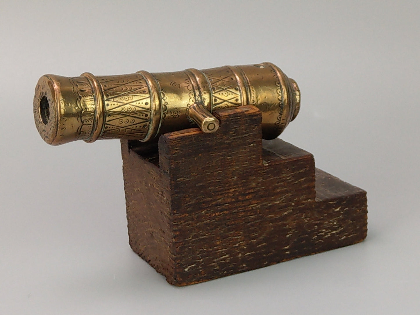 Antique Chased bronze signal cannon on wood stand