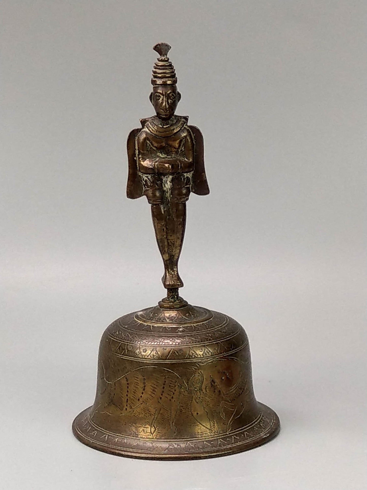 Antique Hindu Hanuman figure bell etched with horses and antelope